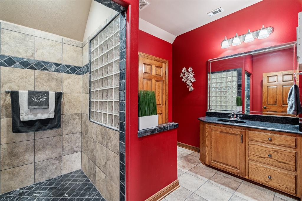 145 County Road 2327 Decatur, TX 76234 - Photo 32 of 40 Upstairs bathroom with large walk-in shower.