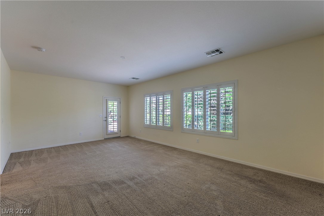 2276 Saxtons River Road Henderson, NV 89044 - Photo 17 of 49 Owner's Suite with Walk-In Closet, and Door to Back Patio