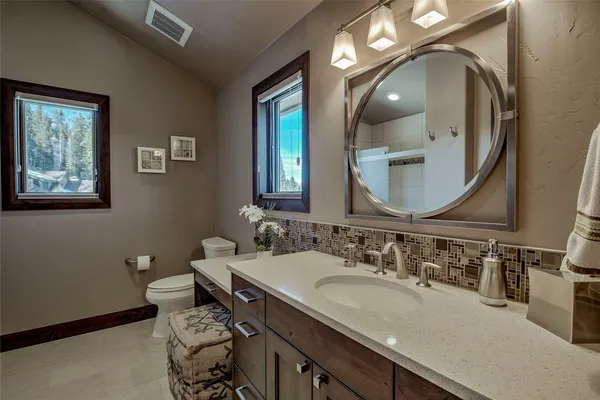 a view of a balcony with furniture and wooden deck