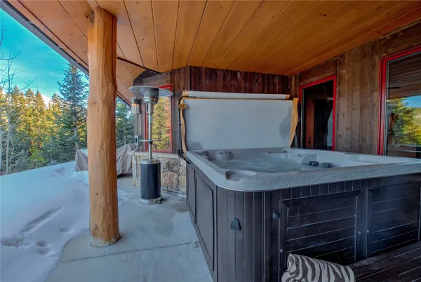 a view of a room with wooden floor and furniture