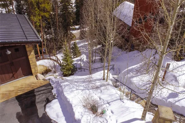 a street sign in front of flowers