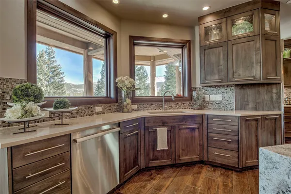 a kitchen with a sink stove and cabinets