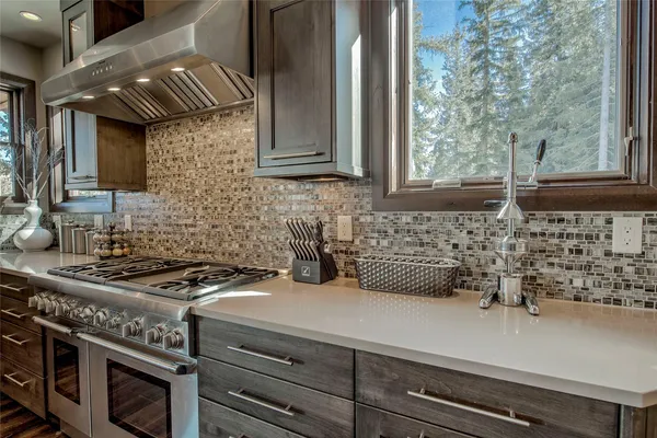 a kitchen with a stove and a sink