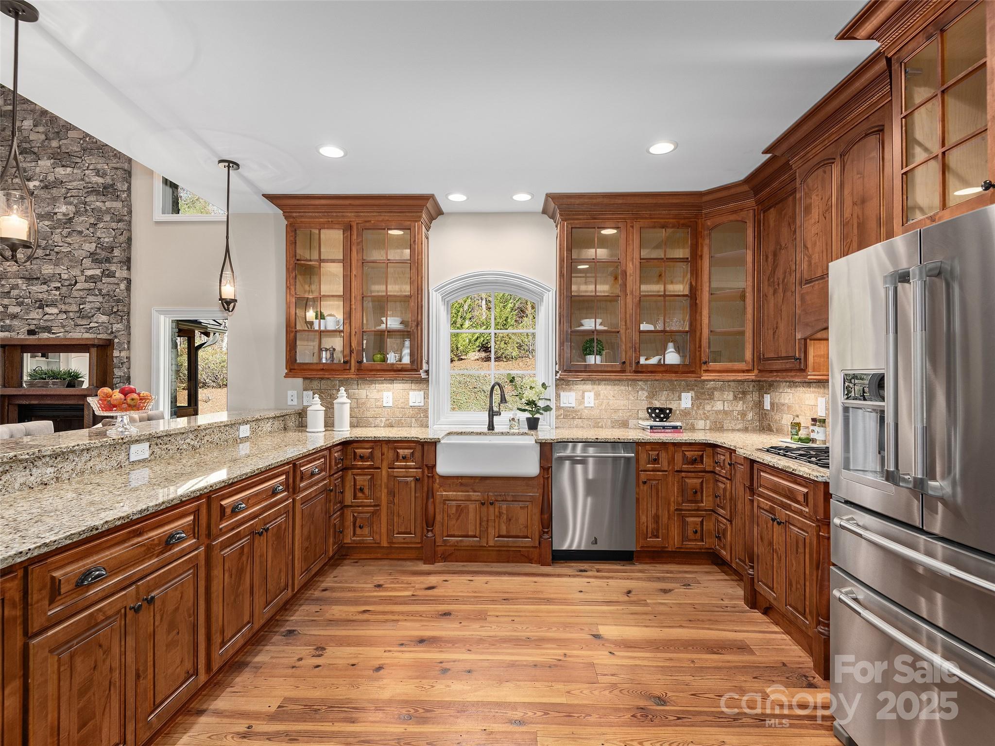 2514 Oakdale Road Old Fort, NC 28762 - Photo 16 of 48 a large kitchen with stainless steel appliances granite countertop a stove a sink dishwasher and a refrigerator