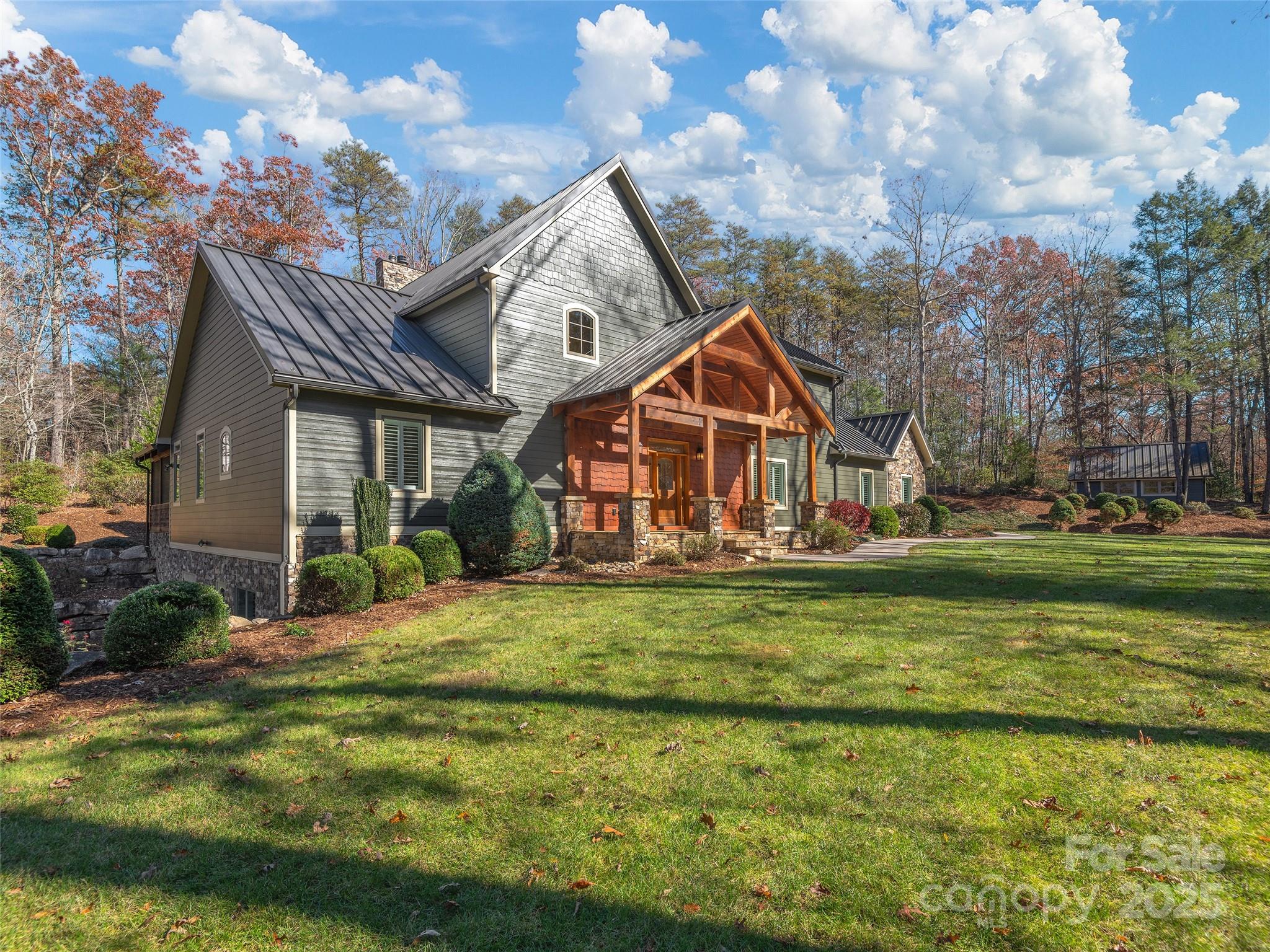 2514 Oakdale Road Old Fort, NC 28762 - Photo 2 of 48 a view of a house with a big yard potted plants and large tree