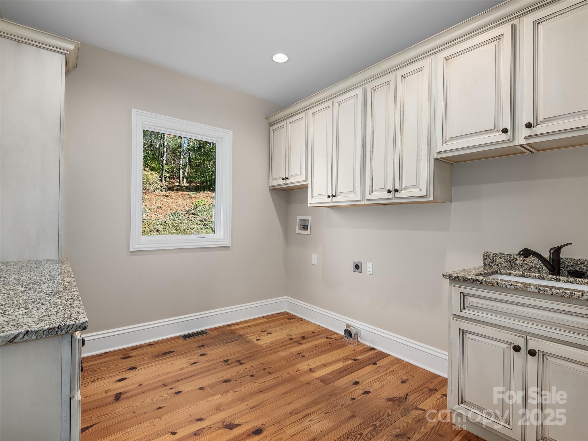 2514 Oakdale Road Old Fort, NC 28762 - Photo 24 of 48 a room with kitchen island granite countertop wooden cabinets and a stove