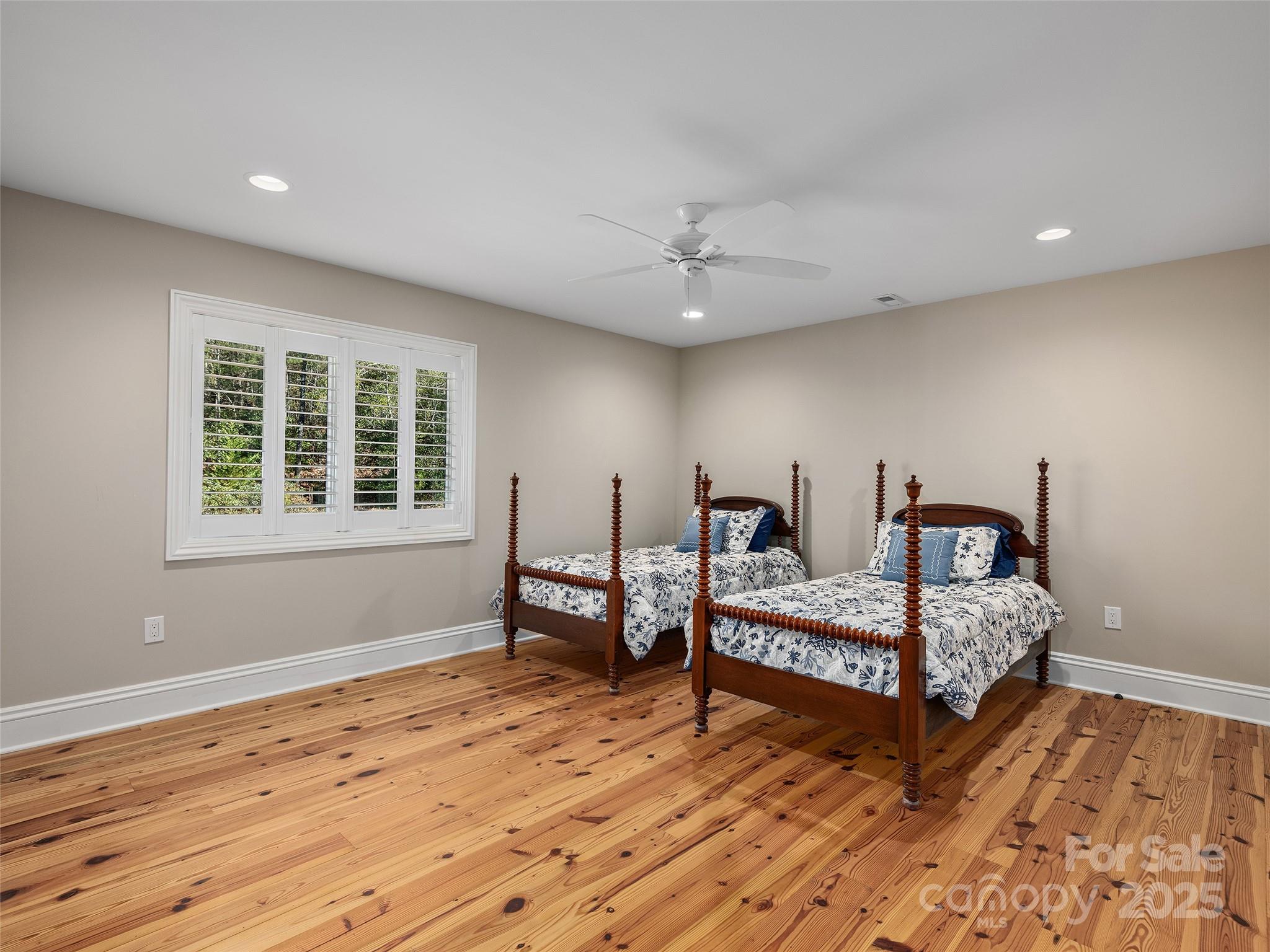 2514 Oakdale Road Old Fort, NC 28762 - Photo 28 of 48 a spacious bedroom with two beds and windows