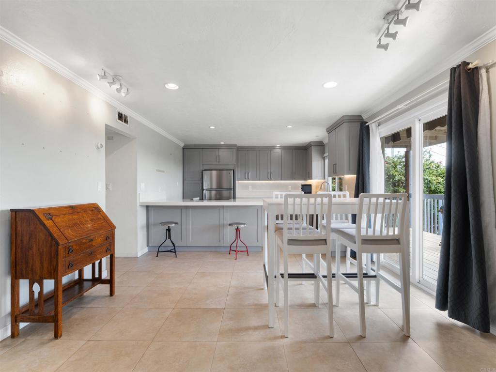 852 Dewitt Avenue Encinitas, CA 92024 - Photo 12 of 41 a dining room with furniture and a kitchen view