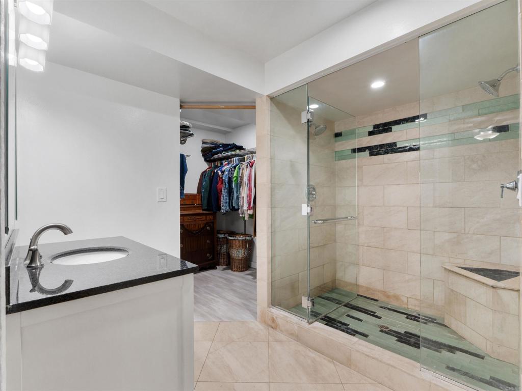 852 Dewitt Avenue Encinitas, CA 92024 - Photo 21 of 41 a bathroom with a shower and a sink