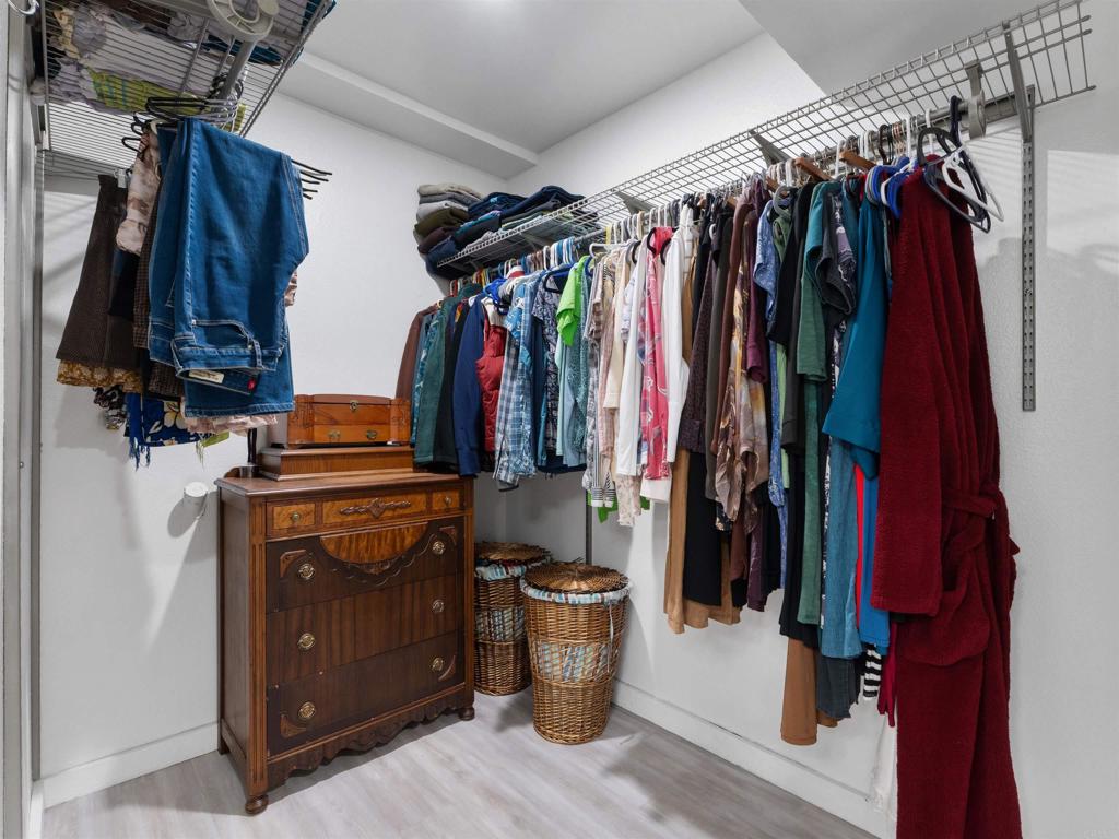 852 Dewitt Avenue Encinitas, CA 92024 - Photo 23 of 41 a view of walk in closet with clothes and shoes