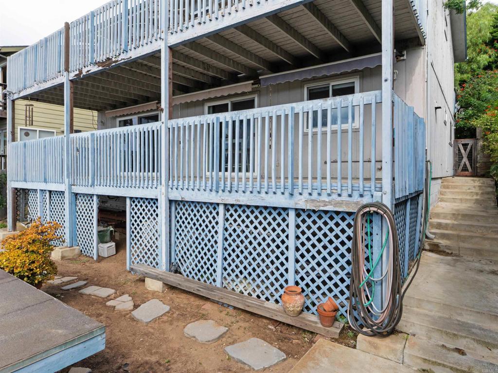 852 Dewitt Avenue Encinitas, CA 92024 - Photo 34 of 41 a roof deck with wooden floor and a fence