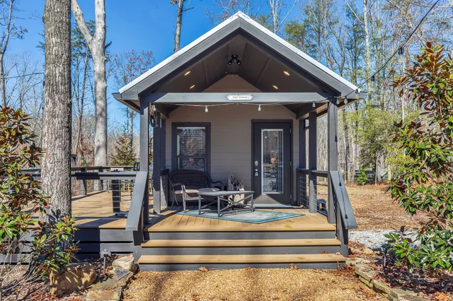 a front view of house with a garden and patio