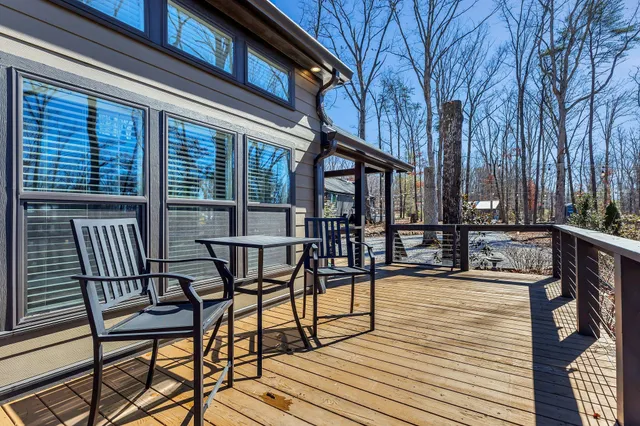 a view of a chairs and table on the deck