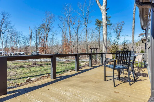 a view of a chairs and table in the balcony