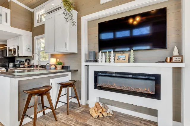 a kitchen with stainless steel appliances a stove microwave and cabinets