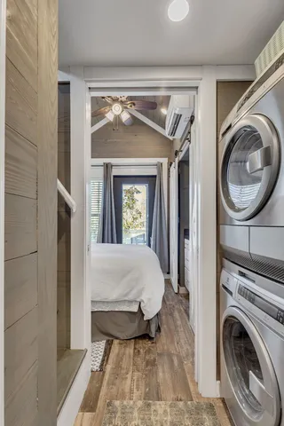 a bedroom with a bed and a mirror