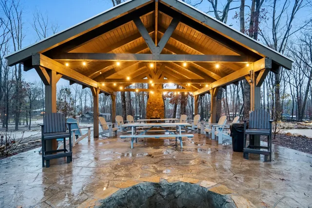 a view of patio with chairs and tables