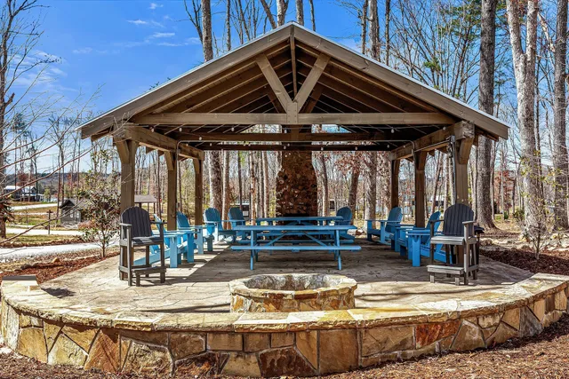 a view of a patio with swimming pool table and chairs