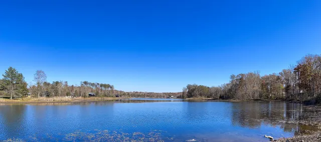 a view of a lake view with mountain in the background