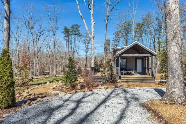 a front view of house with a garden