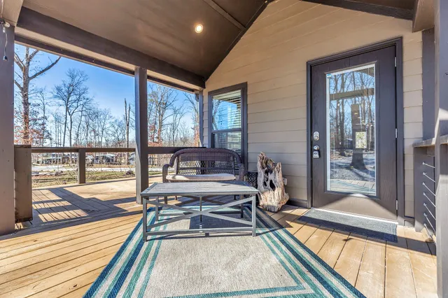 a living room with a large window and a table