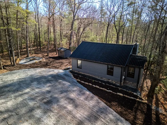 a backyard of a house with trees and outdoor space