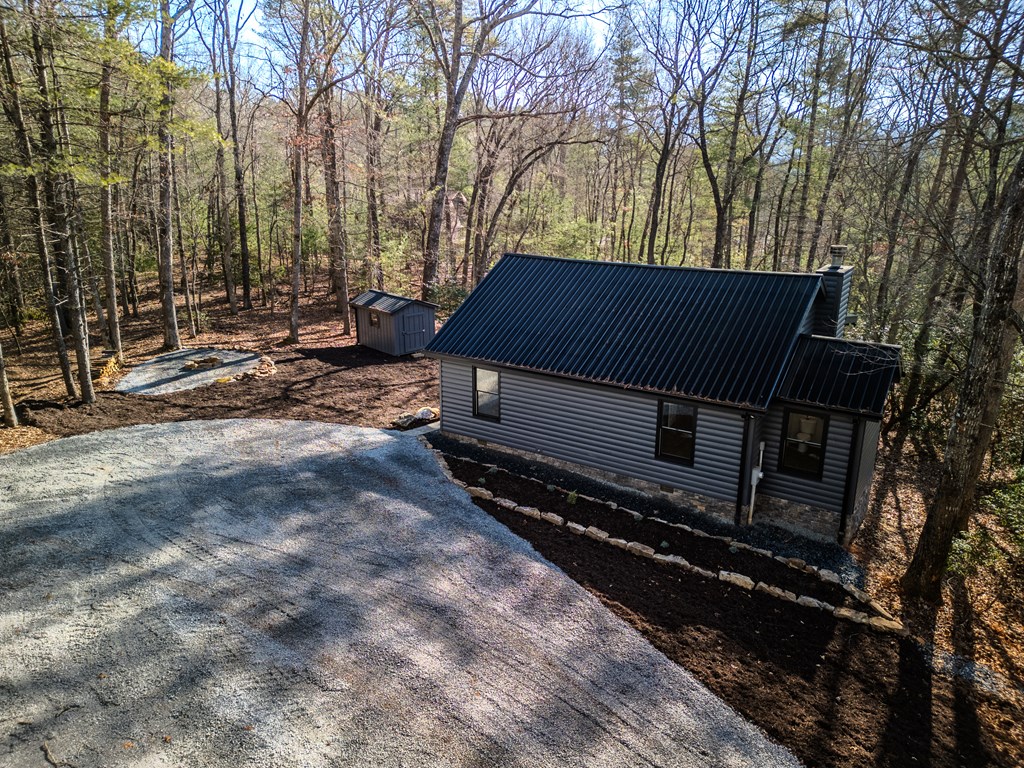 292 Wits End Way Cherry Log, GA 30522 - Photo 15 of 32 a backyard of a house with trees and outdoor space