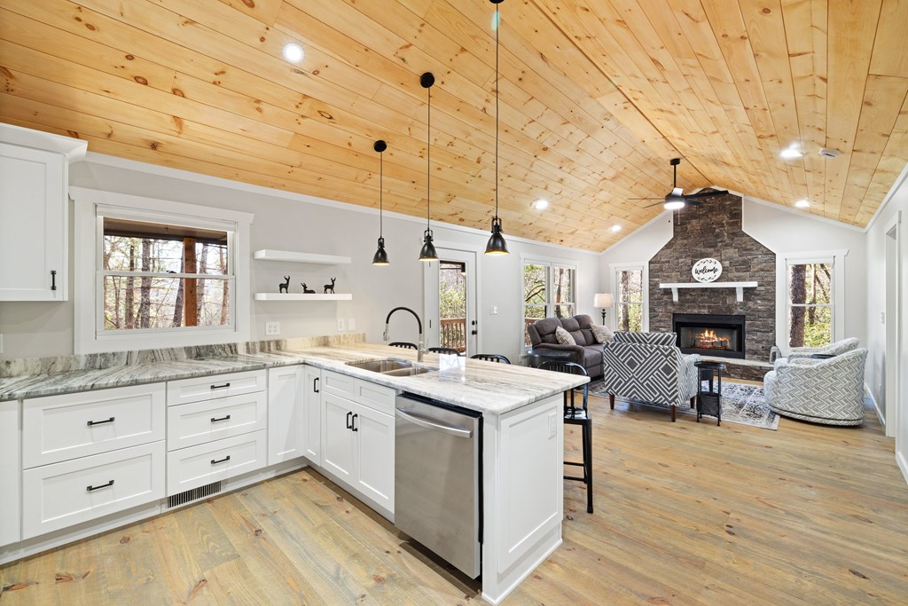 292 Wits End Way Cherry Log, GA 30522 - Photo 2 of 32 a large kitchen with lot of counter top space and wooden floor