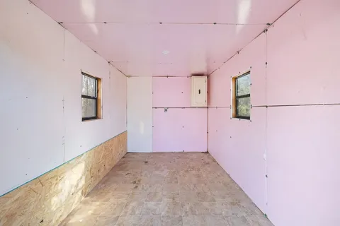 a view of a hallway with closet