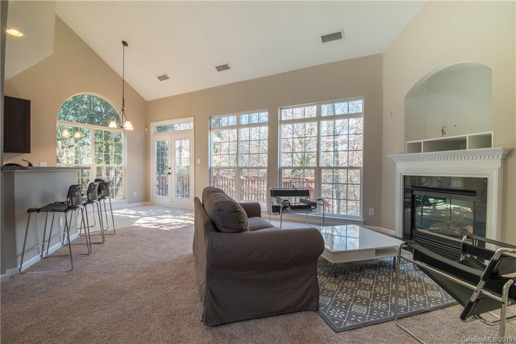 11712 Kennon Ridge Lane Huntersville, NC 28078 - Photo 12 of 31 a living room with furniture and a fireplace