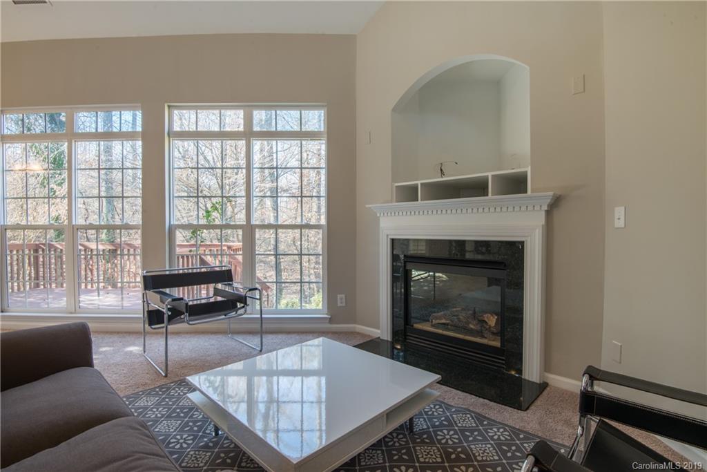 11712 Kennon Ridge Lane Huntersville, NC 28078 - Photo 13 of 31 a living room with furniture and a fireplace
