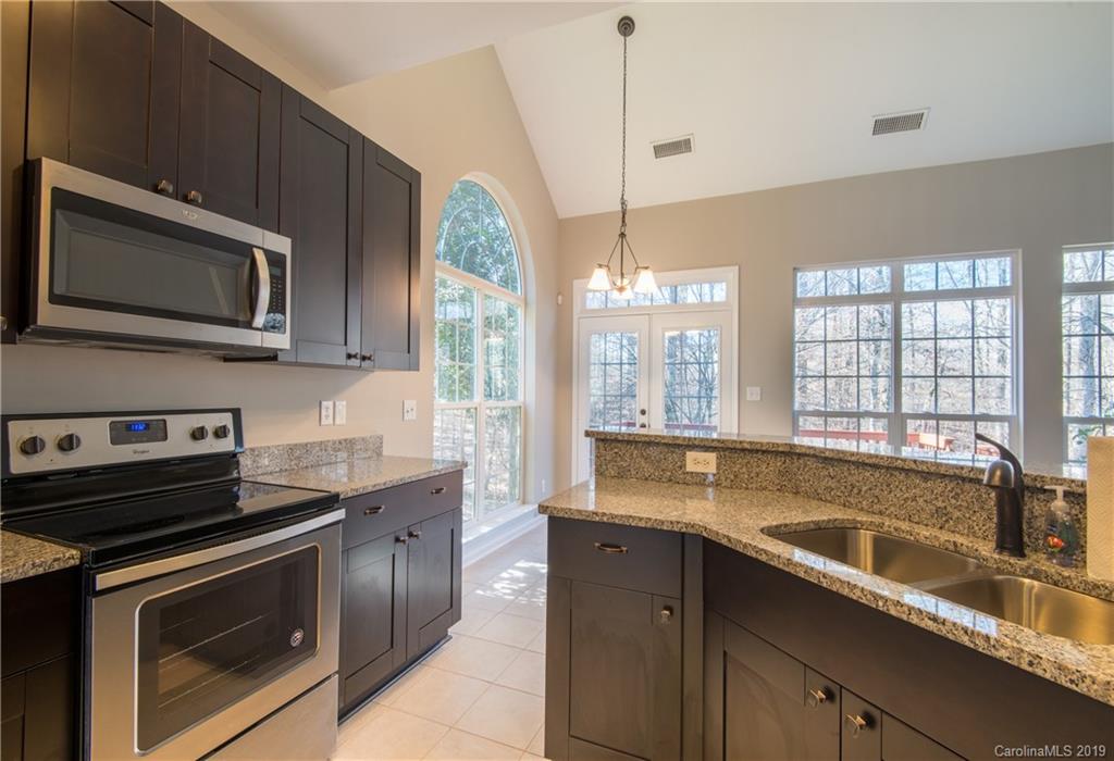 11712 Kennon Ridge Lane Huntersville, NC 28078 - Photo 15 of 31 a kitchen that has a sink and a stove