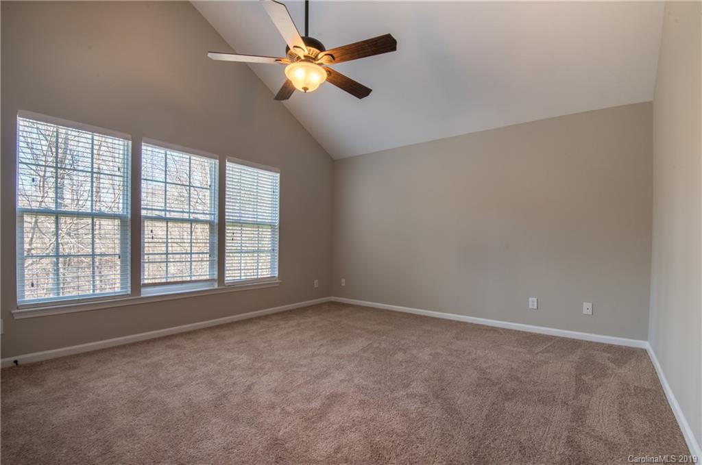 11712 Kennon Ridge Lane Huntersville, NC 28078 - Photo 29 of 31 wooden floor in an empty room with a window