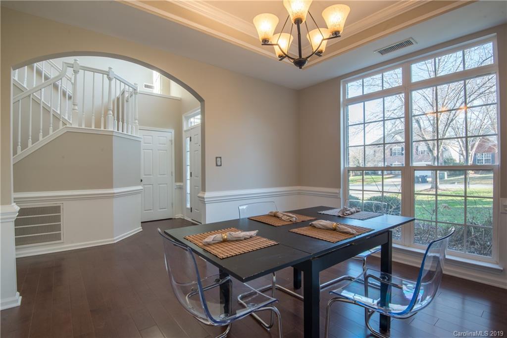 11712 Kennon Ridge Lane Huntersville, NC 28078 - Photo 4 of 31 a view of a dining room with furniture window and wooden floor