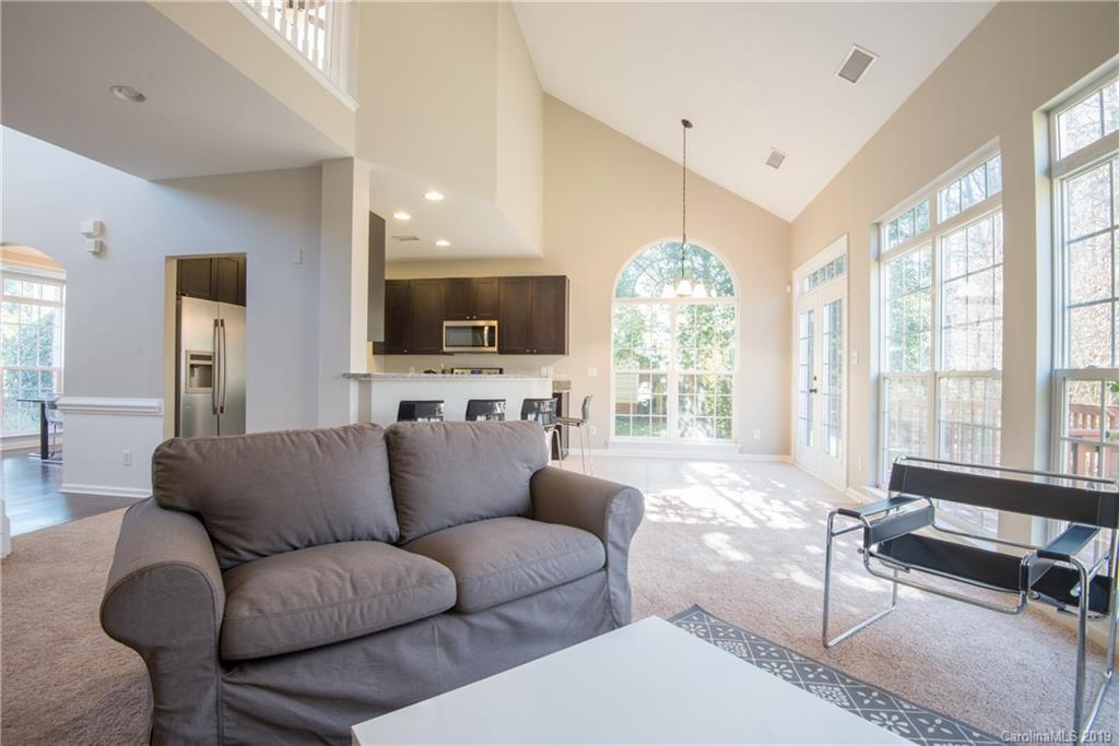 11712 Kennon Ridge Lane Huntersville, NC 28078 - Photo 6 of 31 a living room with furniture and a flat screen tv