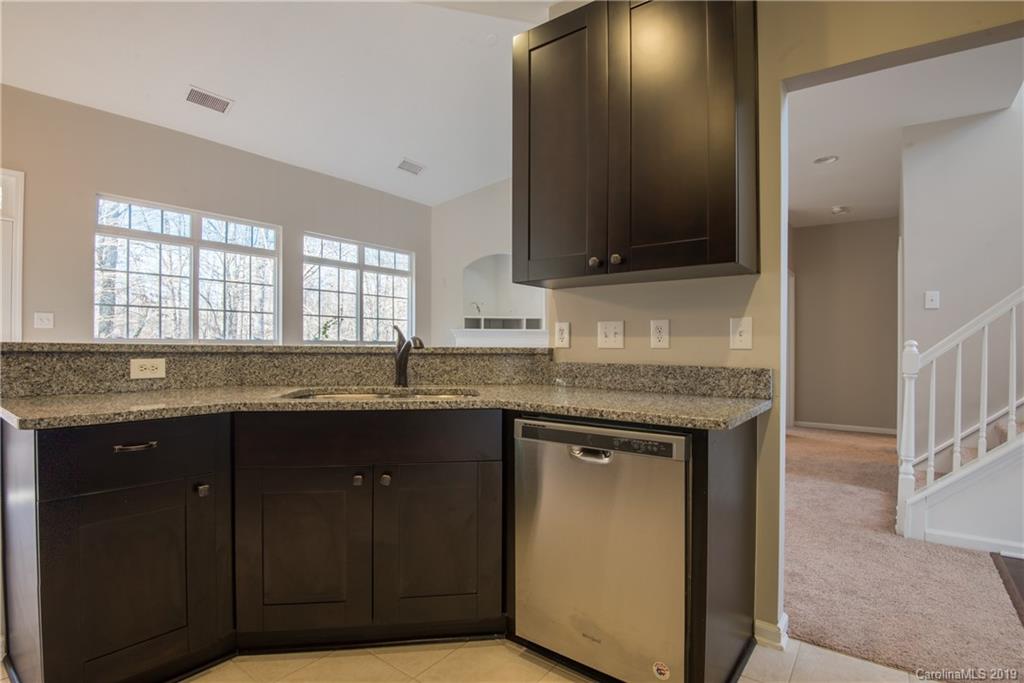 11712 Kennon Ridge Lane Huntersville, NC 28078 - Photo 9 of 31 a bathroom with a granite countertop sink and a mirror