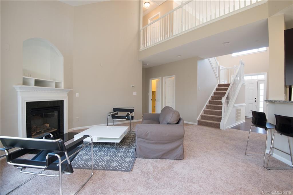 11712 Kennon Ridge Lane Huntersville, NC 28078 - Photo 10 of 31 a living room with furniture and a fireplace