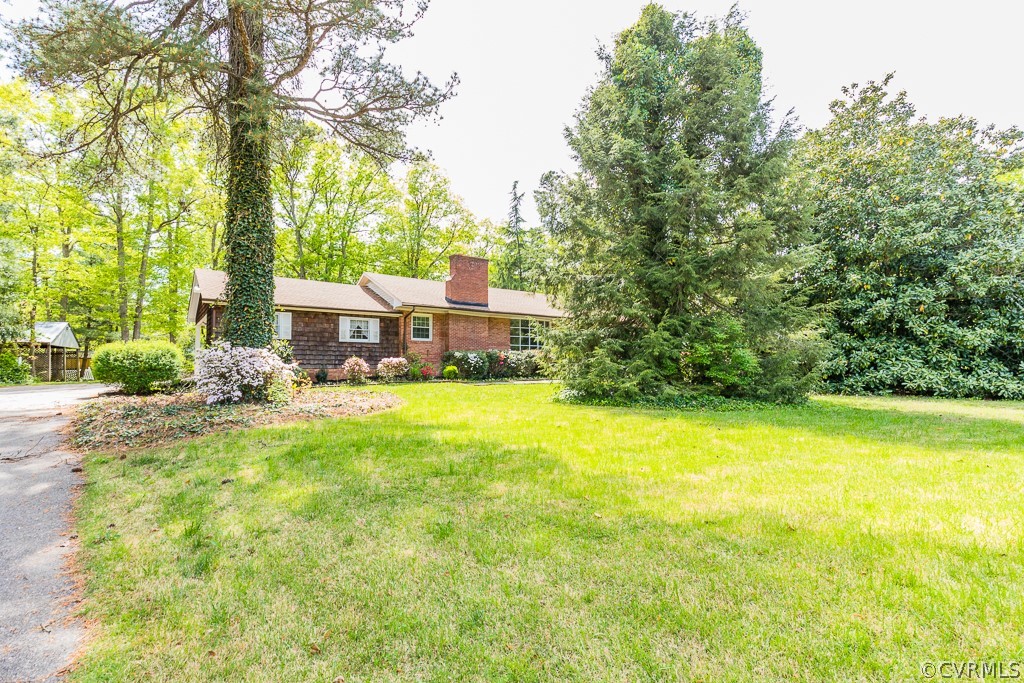 10801 Genito Road Chesterfield, VA 23832 - Photo 2 of 46 a view of a house with pool and sitting area
