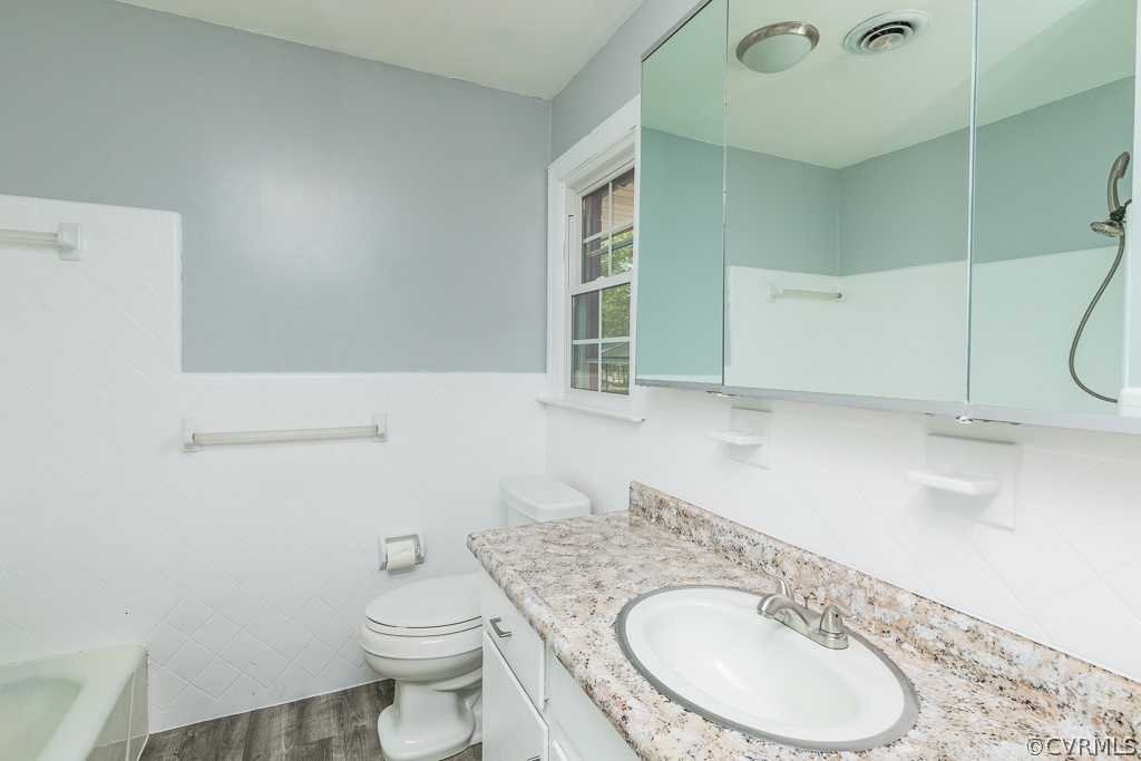 10801 Genito Road Chesterfield, VA 23832 - Photo 21 of 46 a bathroom with a granite countertop toilet sink and mirror