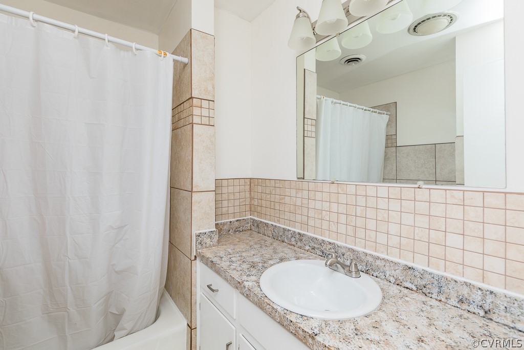 10801 Genito Road Chesterfield, VA 23832 - Photo 26 of 46 a bathroom with a granite countertop sink and a mirror