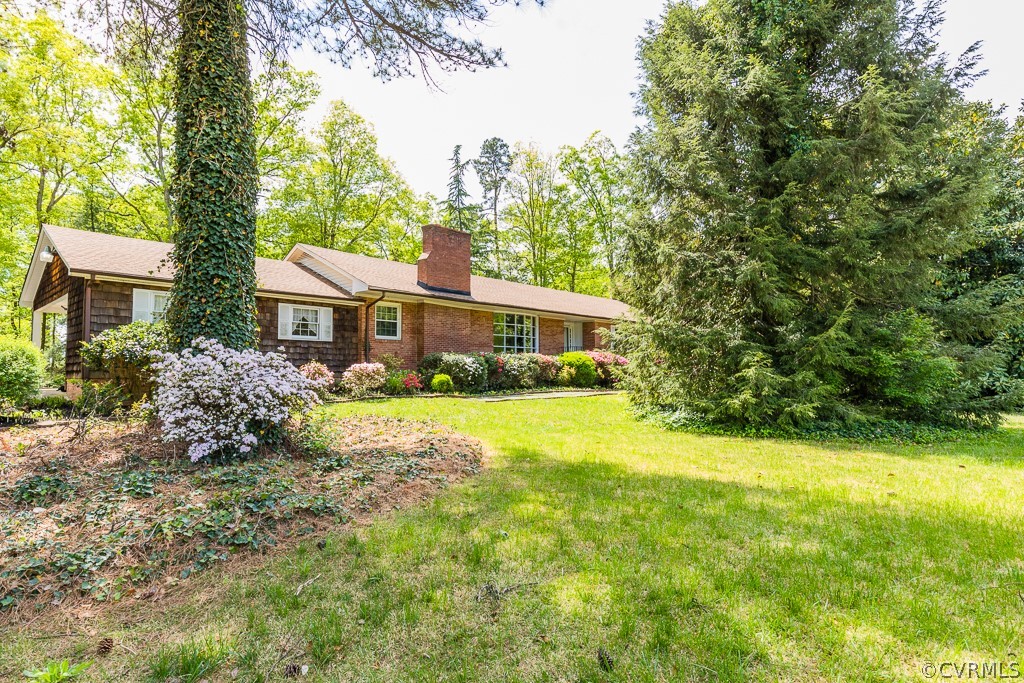 10801 Genito Road Chesterfield, VA 23832 - Photo 38 of 46 a front view of house with yard and trees in the background