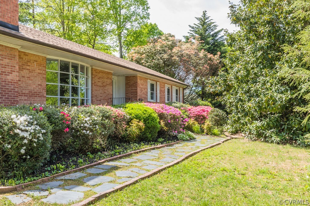 10801 Genito Road Chesterfield, VA 23832 - Photo 39 of 46 a flower garden is sitting in front of a house