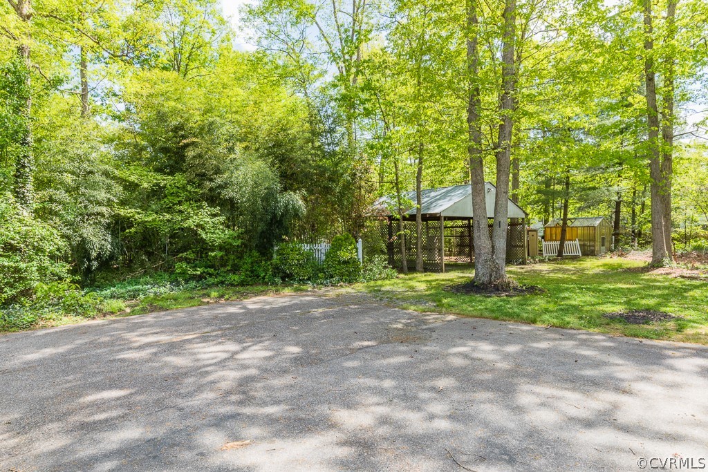 10801 Genito Road Chesterfield, VA 23832 - Photo 40 of 46 a view of a yard with plants and trees