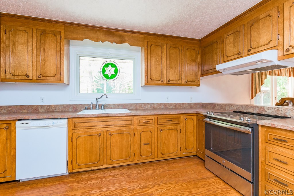 10801 Genito Road Chesterfield, VA 23832 - Photo 10 of 46 a kitchen with stainless steel appliances granite countertop a sink dishwasher stove and cabinets with wooden floor
