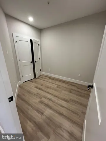 a bed room with a bed and a mirror