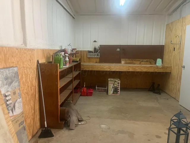 a room with furniture and a air conditioner vent