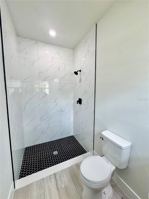 1690 Hamilton Avenue Southwest Palm Bay, FL 32908 - Photo 13 of 56 a bathroom with a toilet and a shower