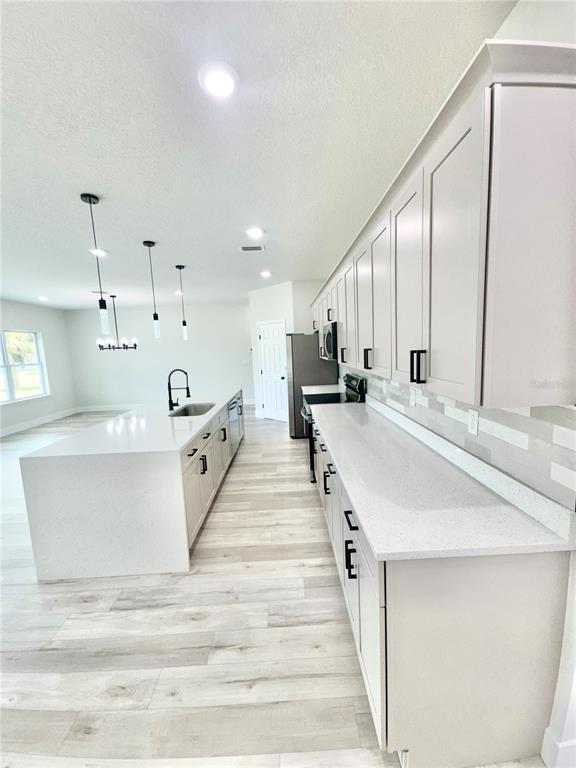 1690 Hamilton Avenue Southwest Palm Bay, FL 32908 - Photo 18 of 56 a large white room with a large window