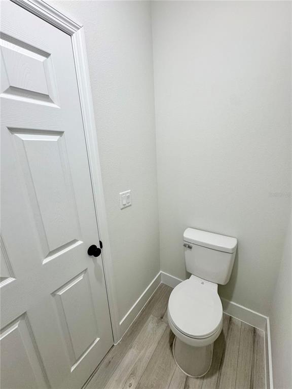 1690 Hamilton Avenue Southwest Palm Bay, FL 32908 - Photo 40 of 56 a white toilet sitting next to a shower