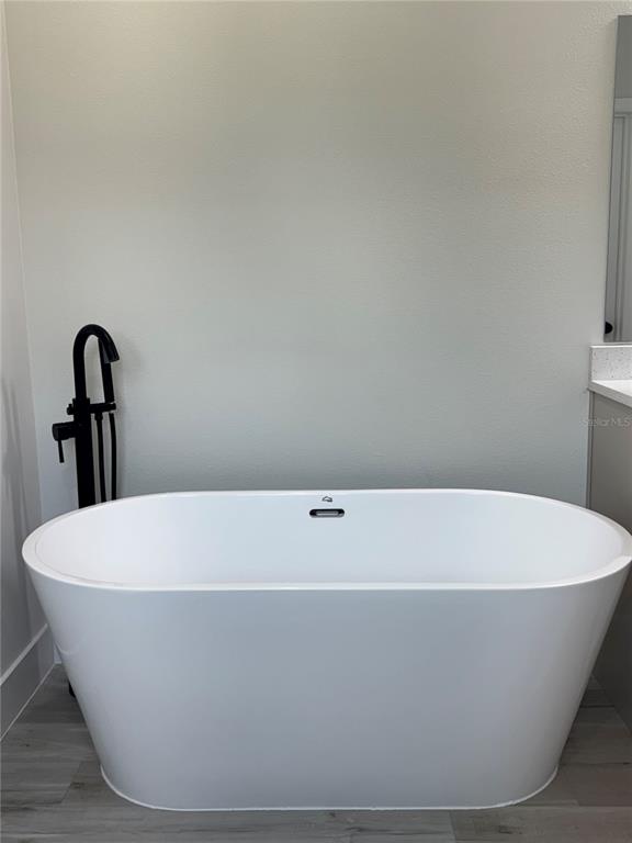 1690 Hamilton Avenue Southwest Palm Bay, FL 32908 - Photo 42 of 56 a white tub sitting in a bathroom